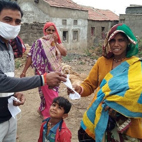 Tailors in Gujarat's Kutch district distributes face masks to the needy people.