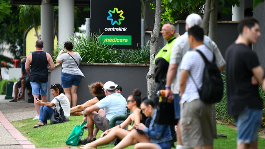 Hundreds of people queue outside a Centrelink in Melbourne.