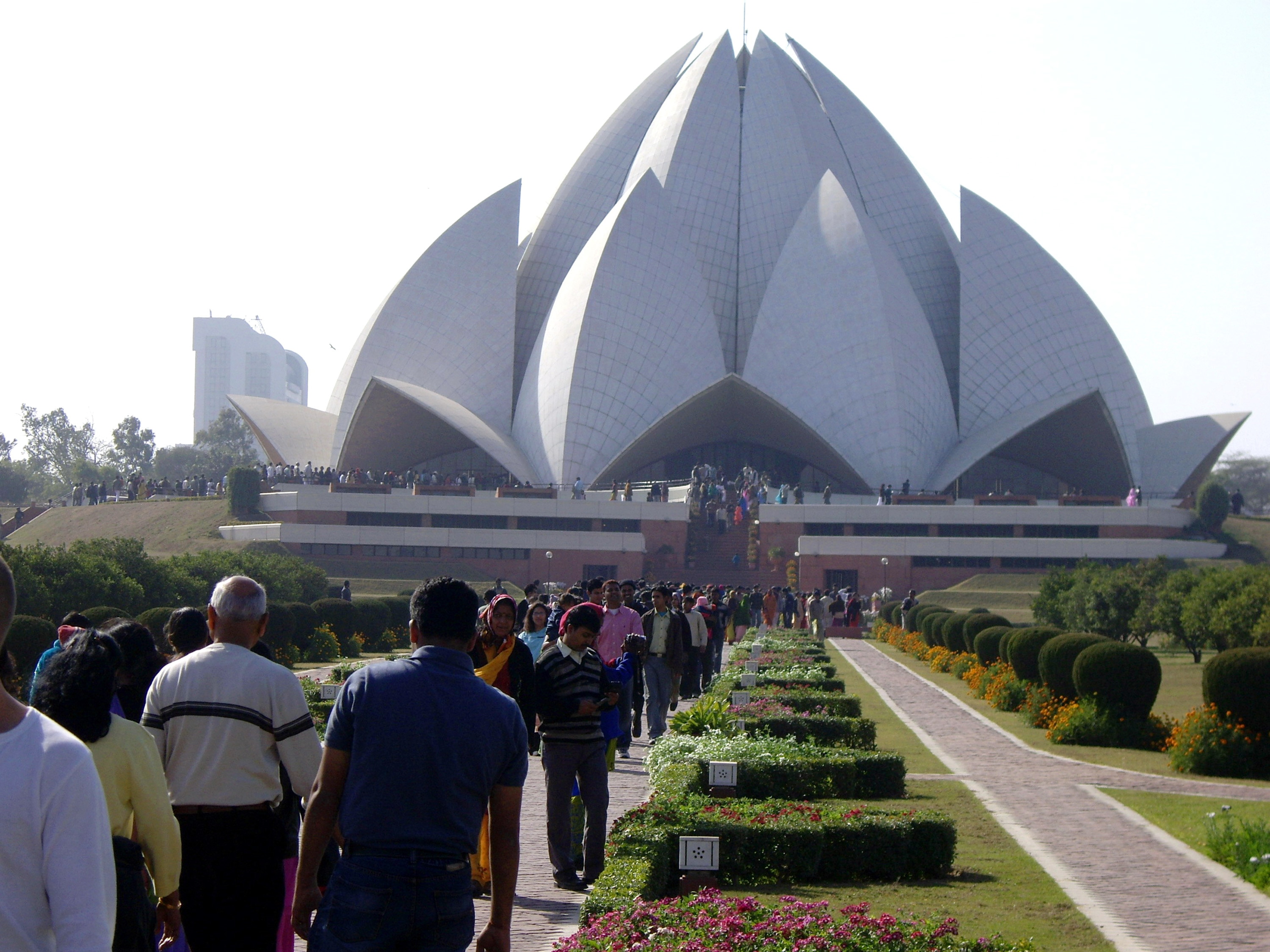 The Baha'i Lotus Temple in Delhi in pre-pandemic times. It is estimated there are some six million Baha'is worldwide. DELHI - Sunday crowds at the Bahai Lotus Temple, Delhi. (AAP Image/David Crawshaw) NO ARCHIVING