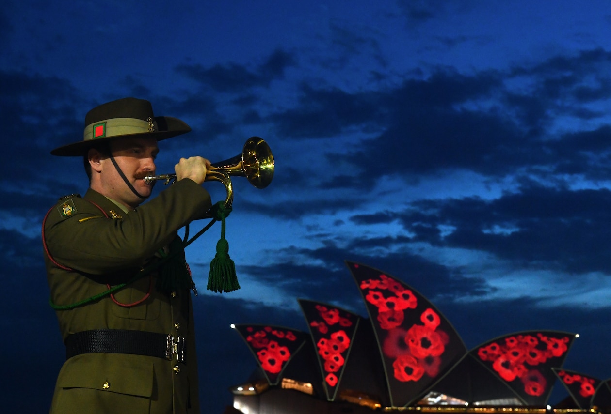 Poppies are projected onto the Sydney Opera House sails during a Remembrance Day 2021 dawn service