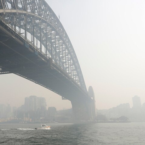 Smoke haze hangs over the Sydney Harbour Bridge in Sydney, Thursday, 21 November, 2019. 
