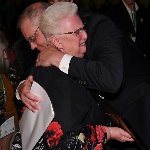 Prime Minister Scott Morrison hugs a child-abuse victim 