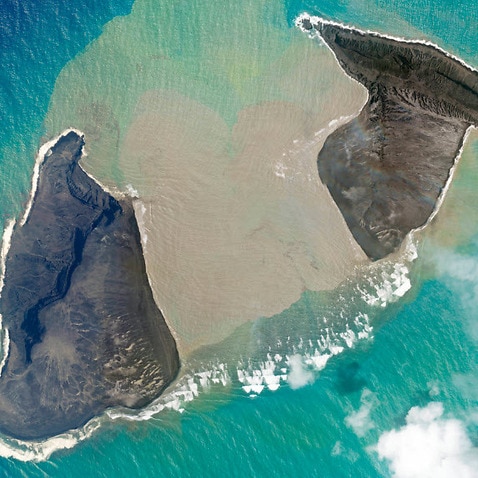 In this satellite photo an island created by the underwater Hunga Tonga Hunga Ha'apai volcano is seen just before a massive eruption on Saturday, 15 January.