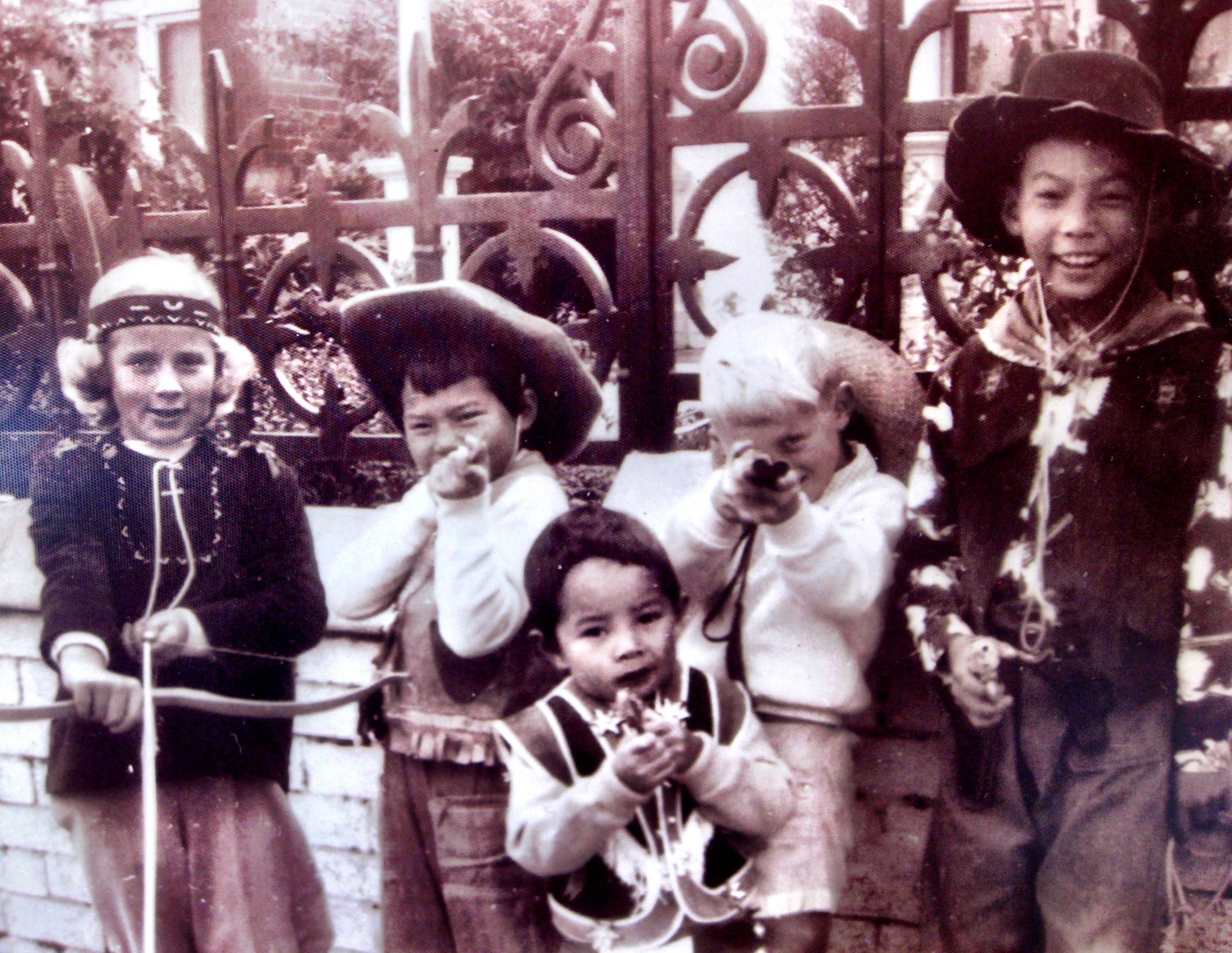 Gabrielle Wang with her childhood friends and siblings dressed up as cowboys. 