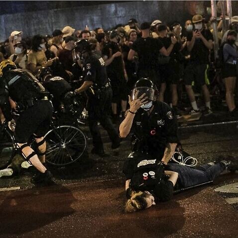Police arrest protesters who broke curfew by marching through Manhattan, New York during a solidarity rally Wednesday, June 3, 2020
