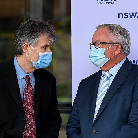 NSW Healths Dr Jeremy McAnulty (left) and NSW Health Minister Brad Hazzard during a COVID-19 press conference in Sydney, Saturday, August 28, 2021.