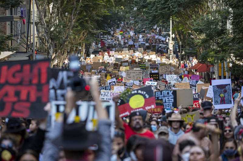 Protesters during the march in Brisbane Protesters during a march in Brisbane