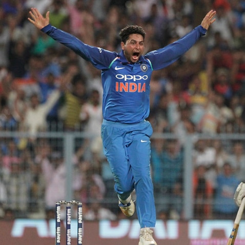 India's Kuldeep Yadav celebrates after taking his third wicket in an over during the second one-day international cricket match against Australia at Eden Gardens in Kolkata, India, Thursday, Sept. 21, 2017. (AP Photo/Bikas Das)