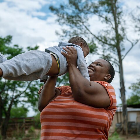 Dora with her son in Botswana