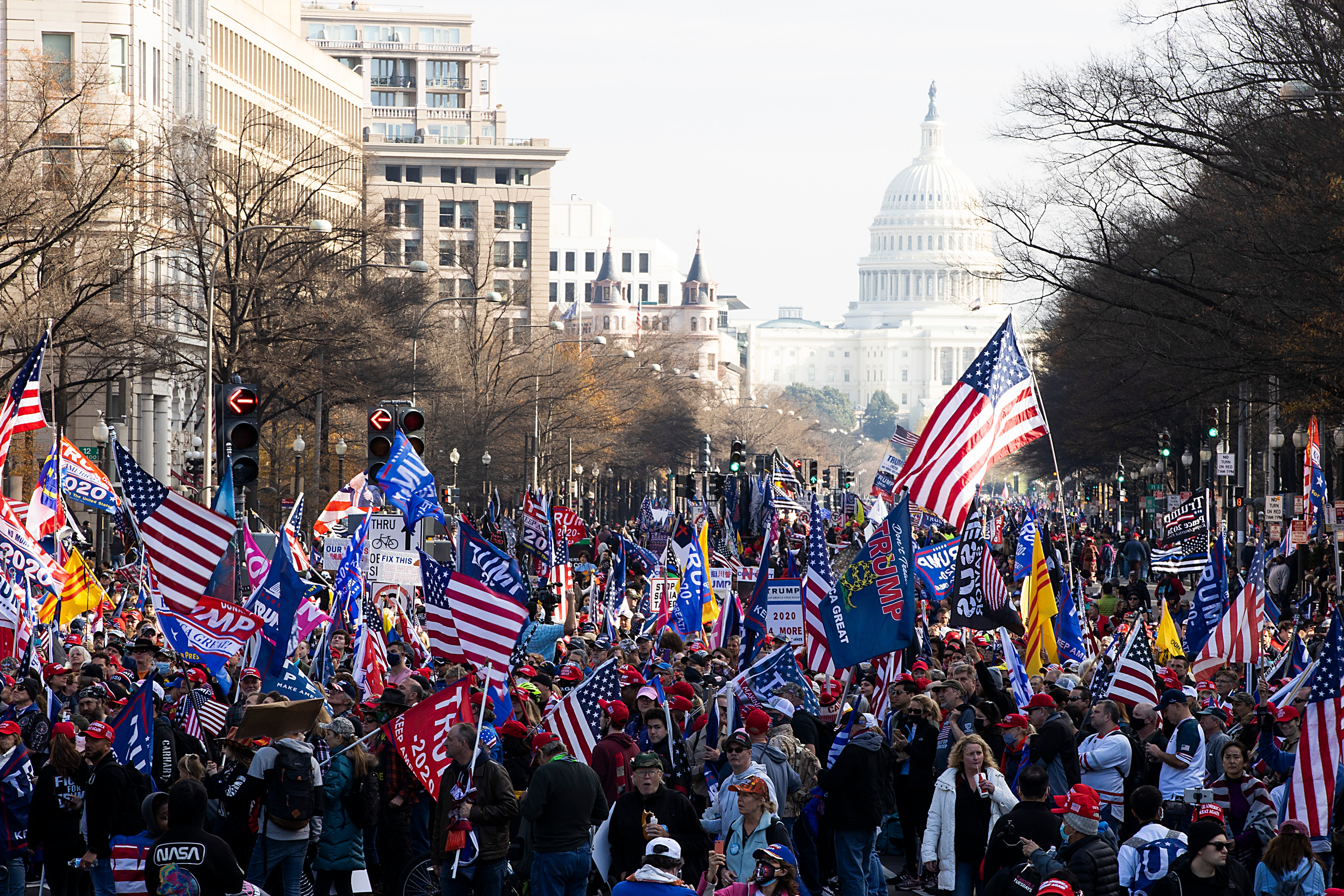 People gather in support of President Donald Trump and in protest the outcome of the 2020 presidential election at freedom plaza on 12 December in Washington. People gather in support of President Donald Trump and in protest the outcome of the 2020 presidential election at freedom plaza on 12 December in Washington.