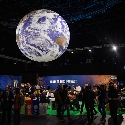 Attendees in the Blue Zone during the COP26 climate talks in Glasgow, Britain, 2 November 2021.