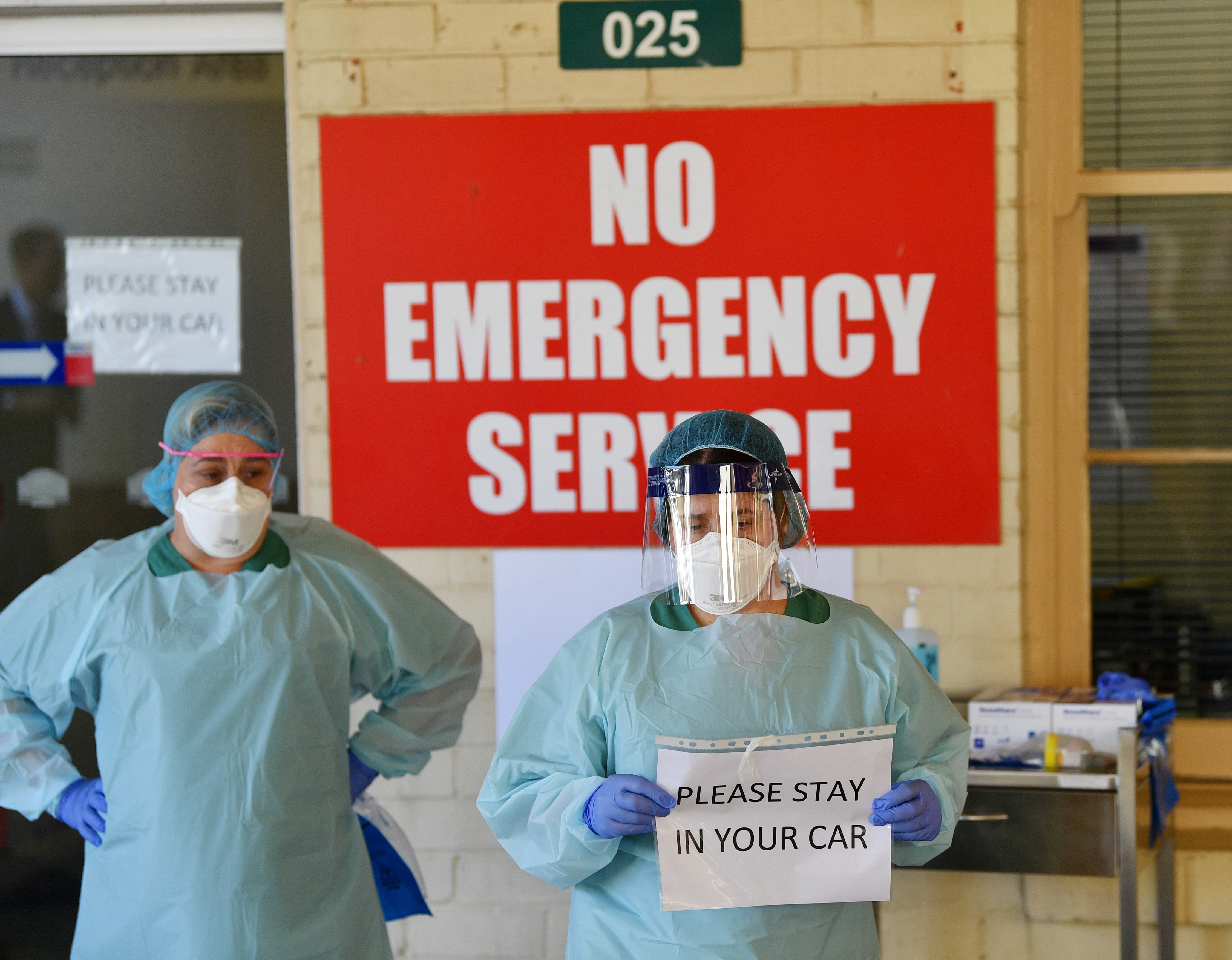 South Australia Hospital staff simulate a drive-through coronavirus testing at the Repatriation Hospital in Adelaide.