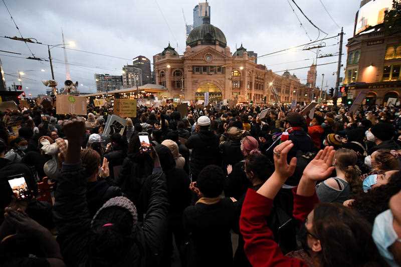 Protesters in Melbourne gather in front of Flinders Street Station Protesters in Melbourne gather in front of Flinders Street Station