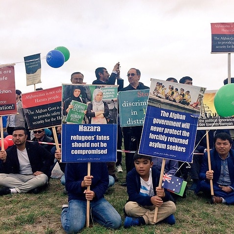 Hazaras protest the arrival of Afghanistan's president at Government House in Canberra on April 4, 2017.