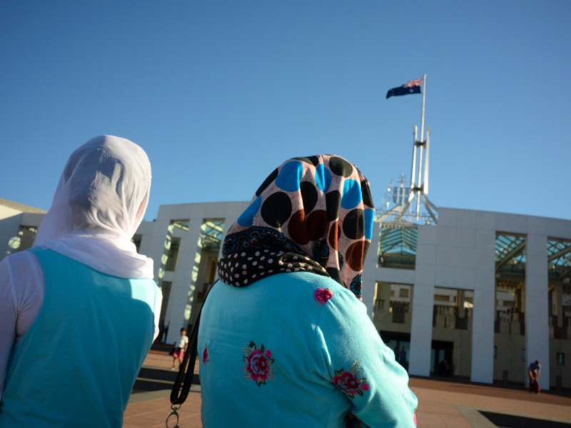 Women wear hijabs outside Parliament House in Canberra
