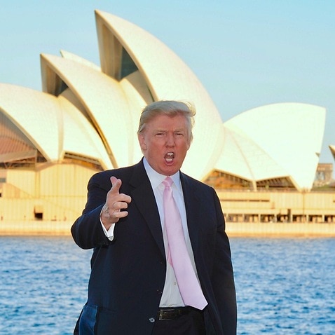 US business magnate Donald Trump poses for a photo in front of the Sydney Opera House, Wednesday, Sept. 21, 2011.