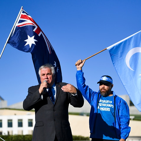 Independent Senator Rex Patrick speaks during a rally for the Uighur community outside Parliament House in Canberra, Monday, 15 March, 2021. 