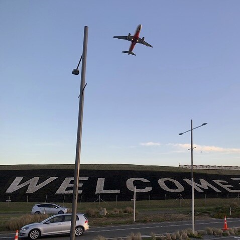 A giant 'Welcome' sign is painted near the main runway of the Wellington International Airport. 