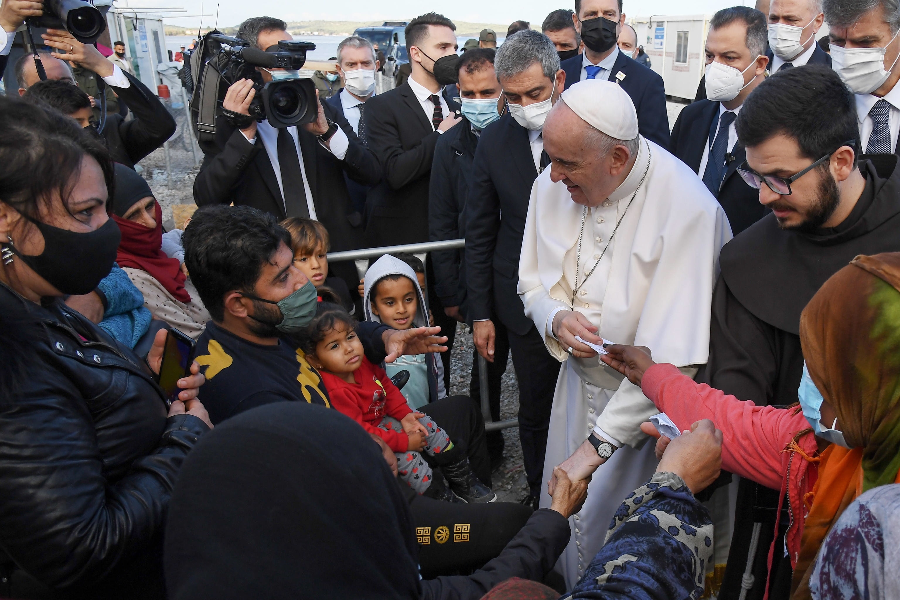Pope Francis speaks with people at the Reception and Identification Center (RIC) in Mytilene on the island of Lesvos, Greece, December 5, 2021. 