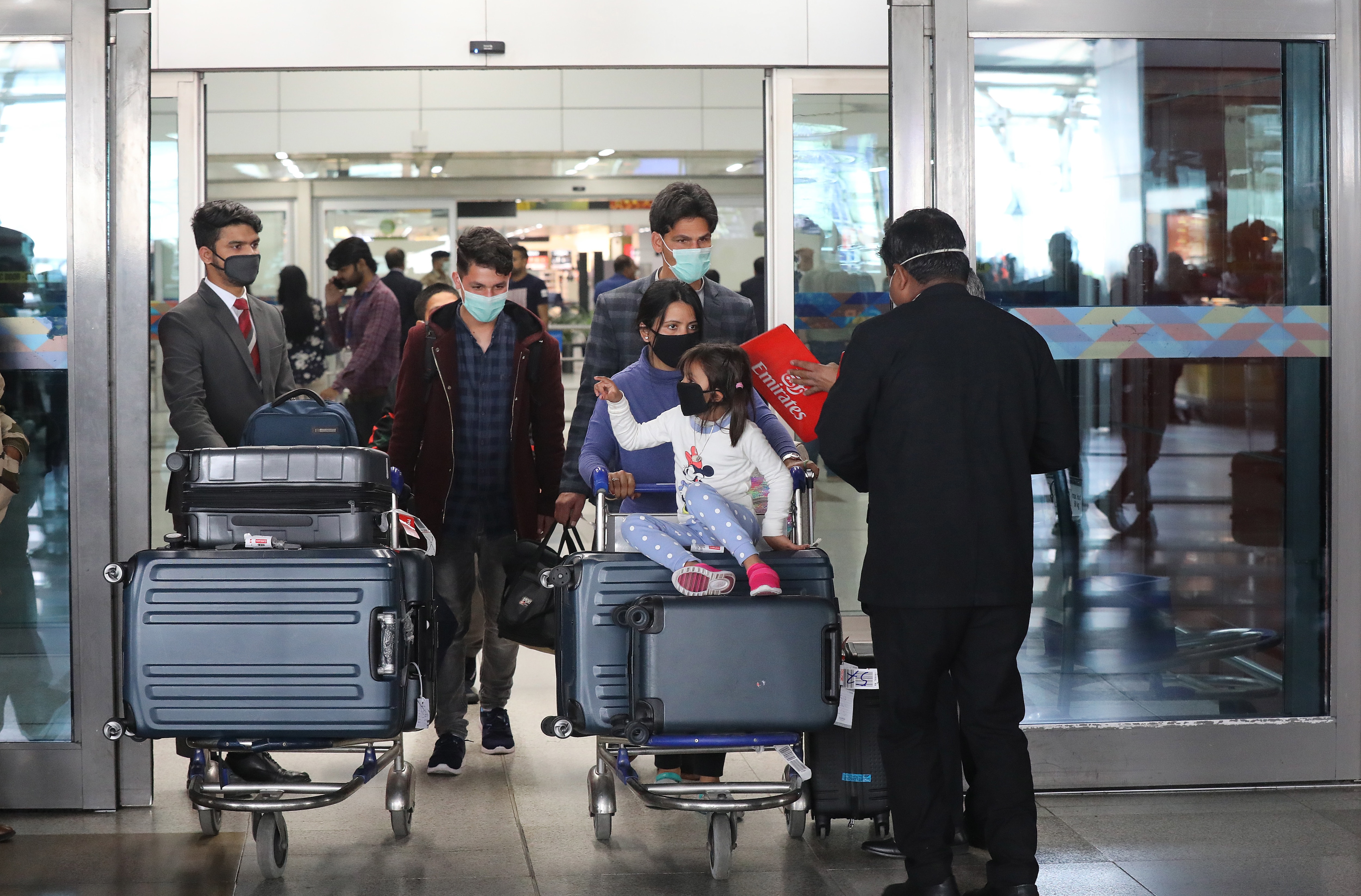 Passengers at the Indira Gandhi International airport in New Delhi, India, 12 March 2020.