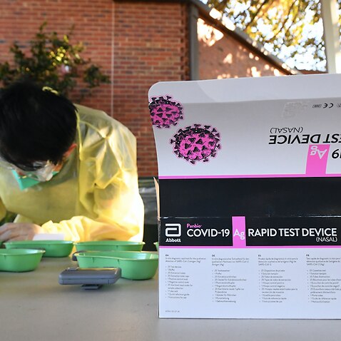 A rapid antigen test sits on a table at Firbank Grammar School in Brighton, Melbourne, October 14, 2021