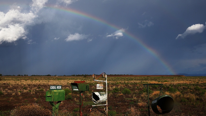 A rainbow appears behind a storm front on the Breeza Plains in north west NSW.