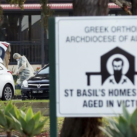 Medical staff are seen outside the St Basil's Home for the Aged.