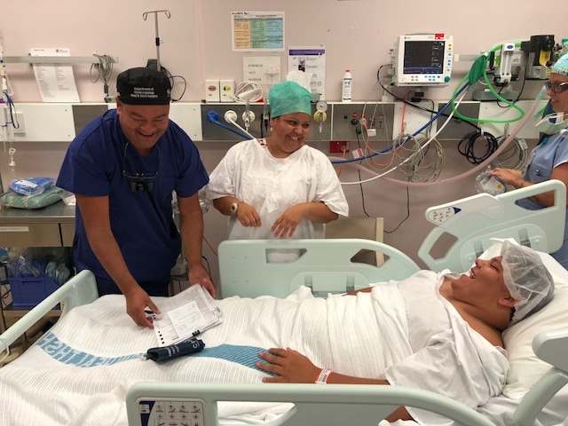 Dr Kong with staff and a 16-year-old patient with hearing issues at Newcastle's John Hunter Hospital in January 2018. 