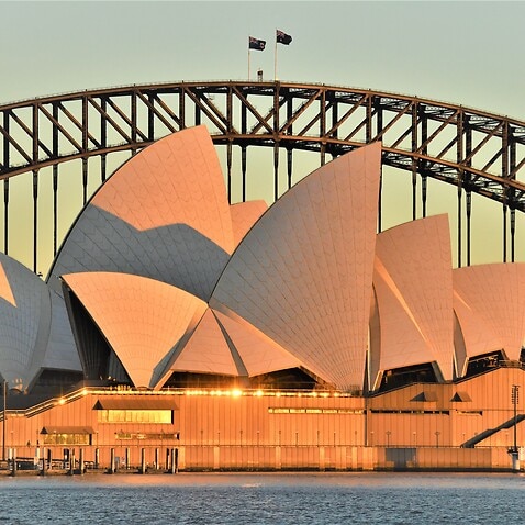 The Sydney Opera House and Sydney Harbour Bridge is seen at dawn in Sydney. 