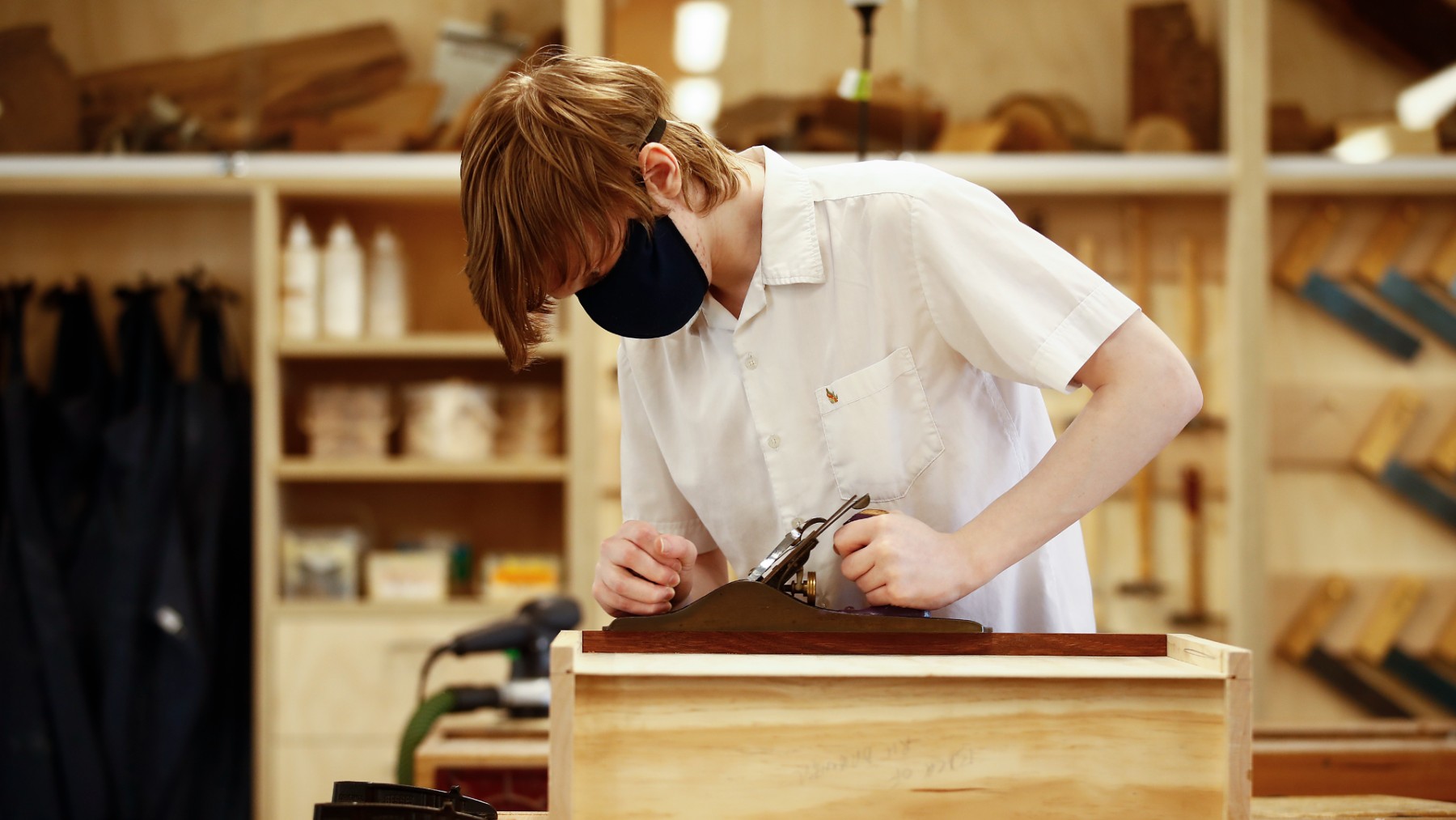 Student takes a woodwork class
