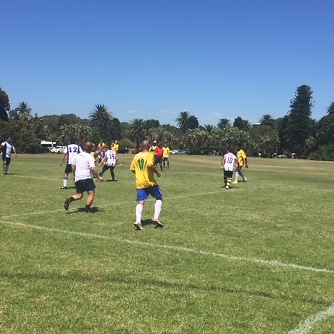 Footballers take part in the 2018 Les Murray Cup at Brazilian Fields in Sydney's Centennial Park.