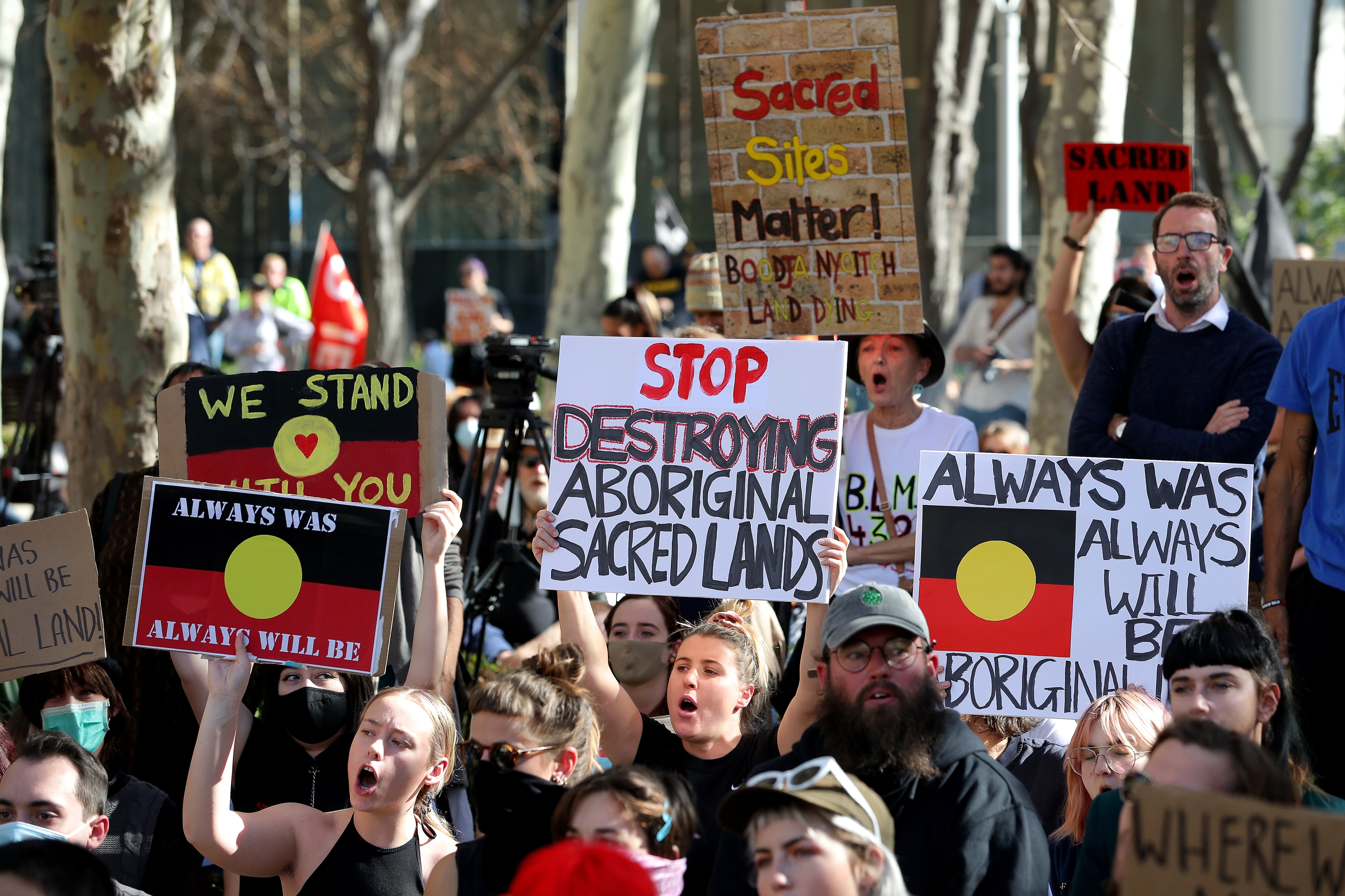 Protesters are seen during a rally outside the Rio Tinto office in Perth, Tuesday, June 9, 2020.. Rio Tinto recently detonated explosives in an area of the Juukan Gorge in the Pilbara, destroying two ancient deep-time rock shelters, much to the distress o