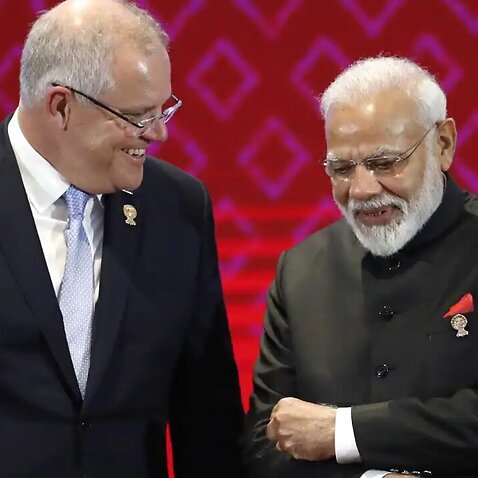 Australia's Prime Minister Scott Morrison chats with India's Prime Minister Narendra Modi (R) during the 14th East Asia Summit on the sidelines of the 35th ASEAN Summit in Thailand, November 2019.
