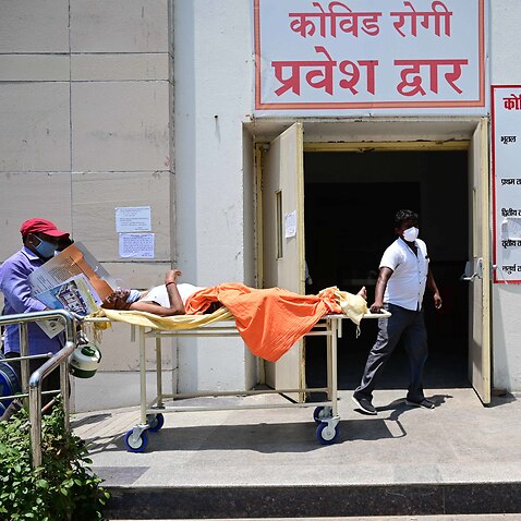 Prayagraj: Family members along with medical workers shift a COVID19 patient to Level-3 ward of Swaroop Rani Nehru hospital in Prayagraj on Thursday, May 08, 2021. (Photo by Prabhat Kumar Verma/Pacific Press/Sipa USA)