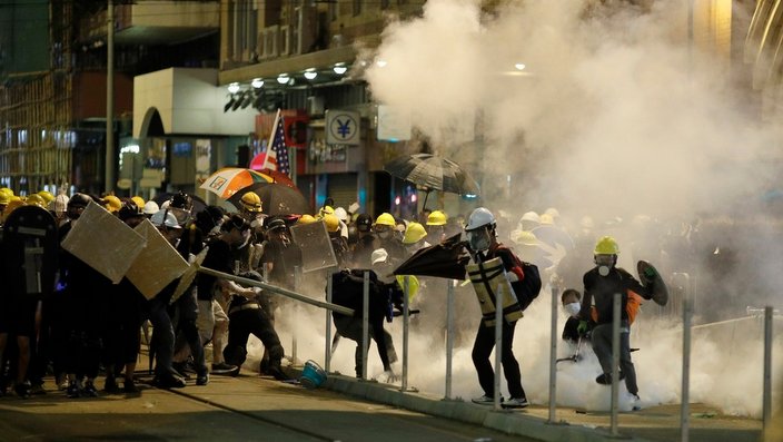 Hong Kong protesters react to teargas. Hong Kong protesters react to teargas.