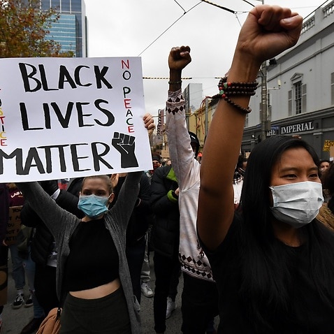 Protesters are seen during a Black Lives Matter rally in Melbourne, Saturday, June 6, 2020.