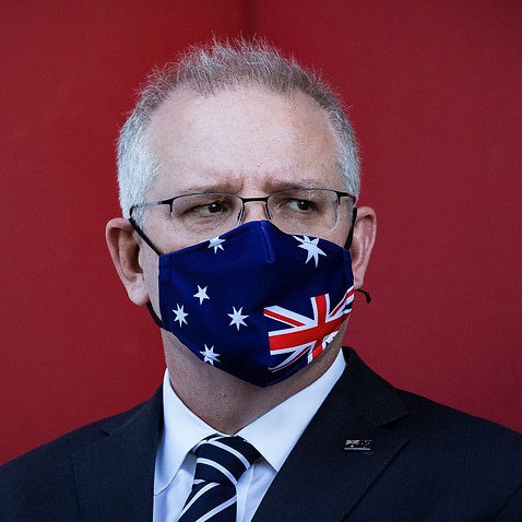 Prime Minister Scott Morrison wearing a patriotic mask at a press conference last week where a COVID-19 vaccine is being produced.