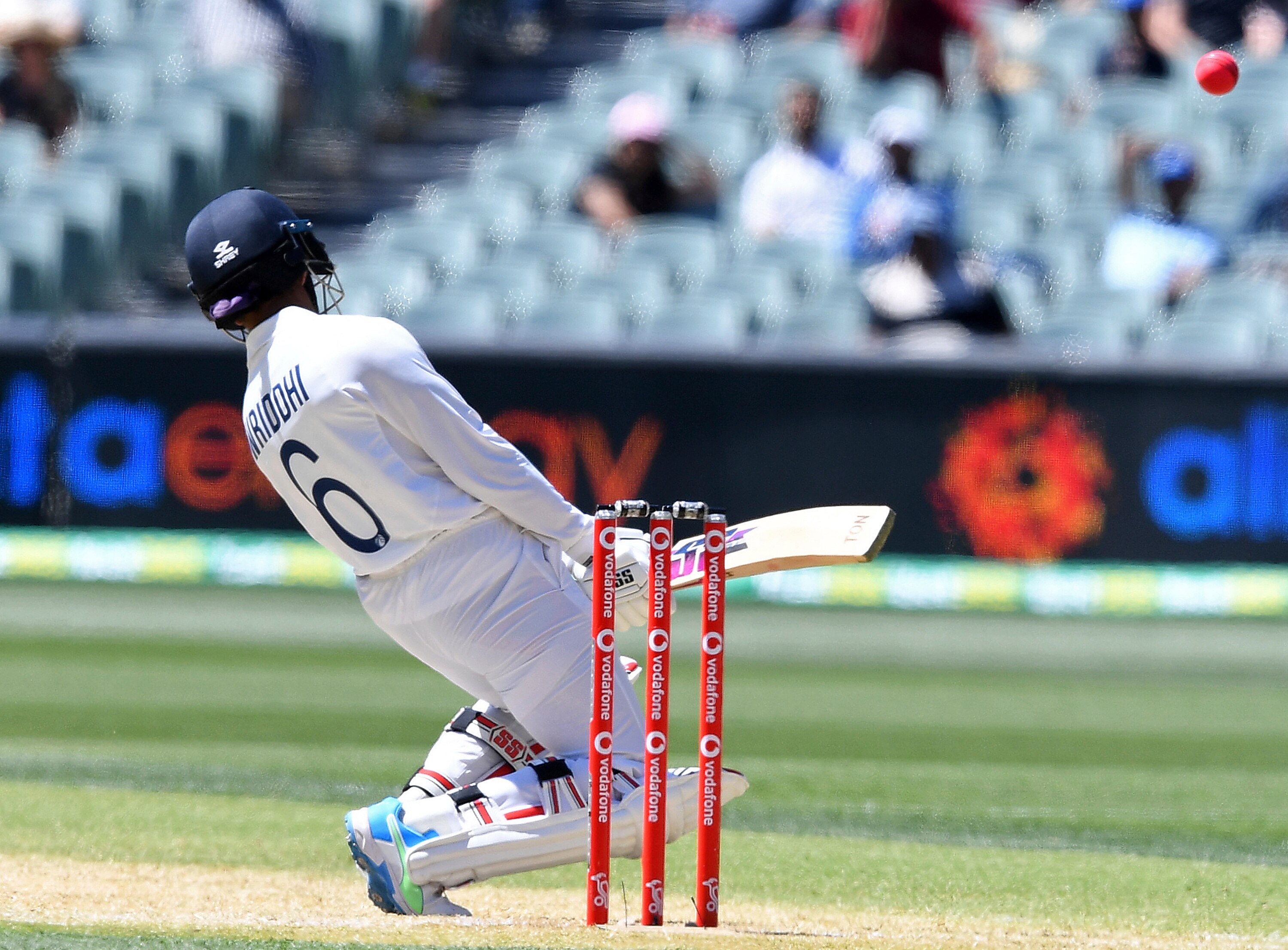 India's Wriddhiman Saha swerves to avoid a high delivery from Australia on the third day of their cricket test match at the Adelaide Oval in Adelaide, Australia, Saturday, Dec. 19, 2020. (AP Photo/David Mairuz)