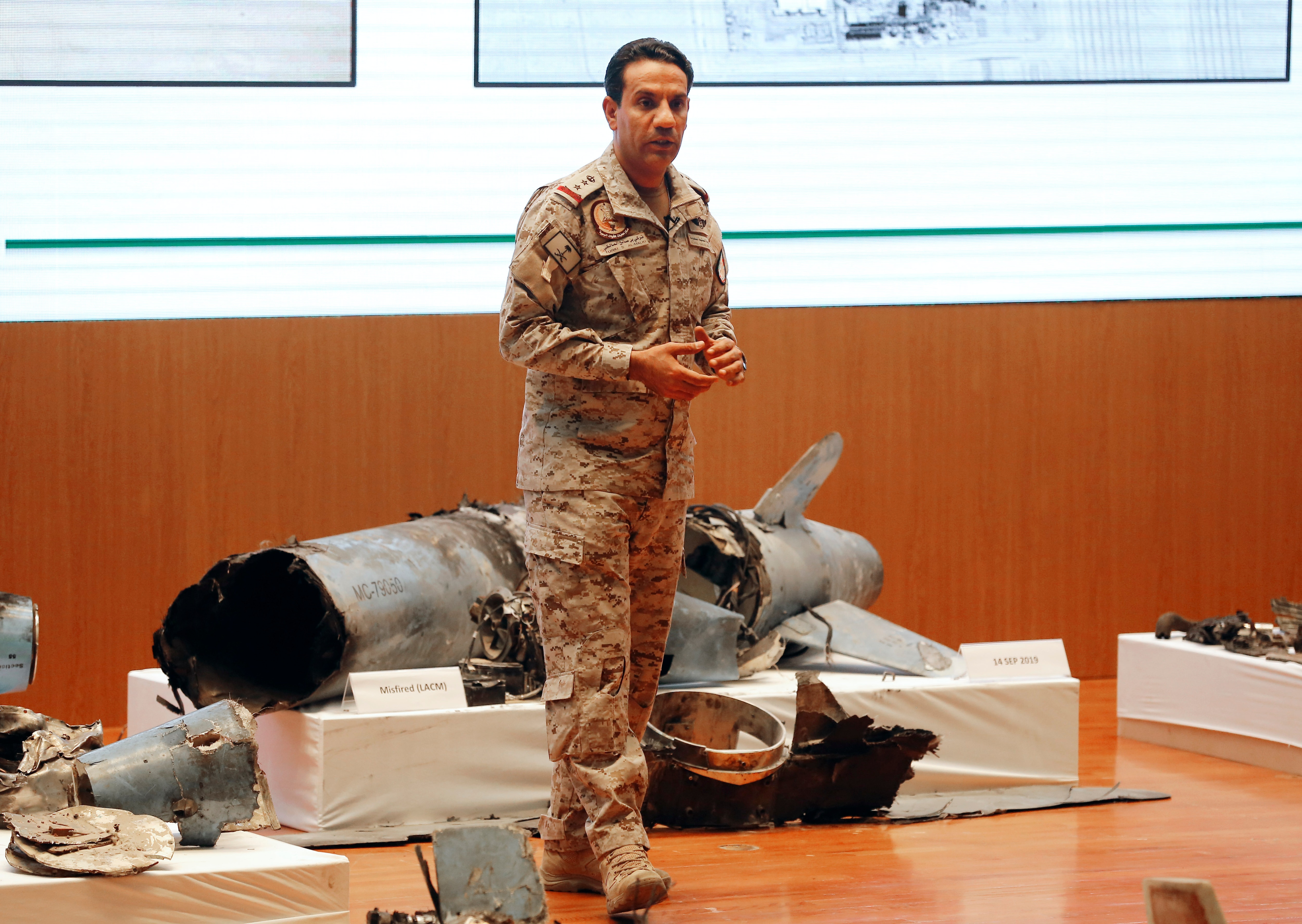 Saudi military spokesman Turki al-Malki displays what he describes as an Iranian cruise missile and drones.