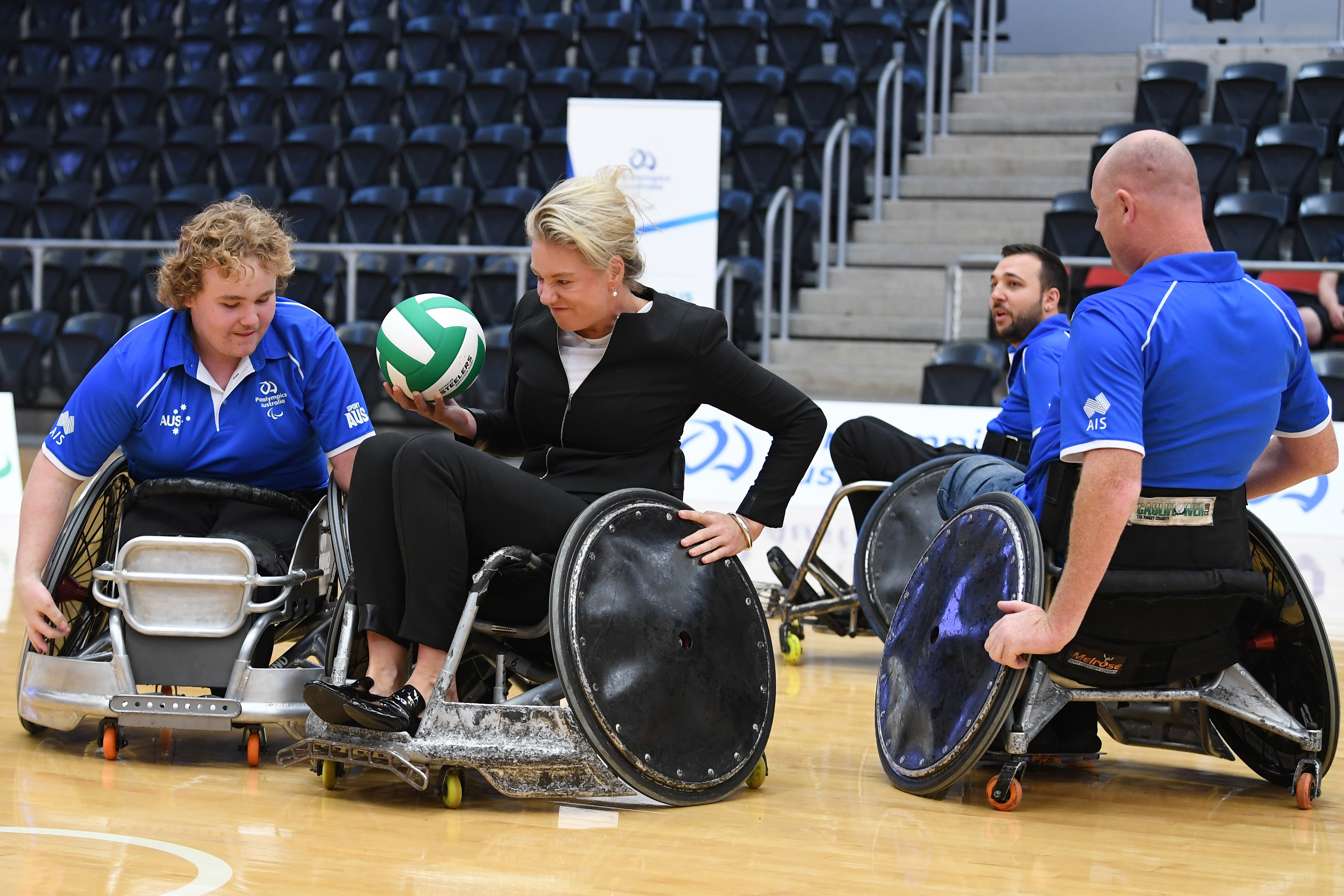Senator Bridget McKenzie plays a game of Wheelchair Rugby with Paralympic athlete.