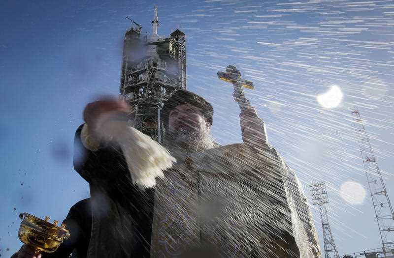 Orthodox priest holds a blessing service in front of the Soyuz FG rocket in the Cosikon-Baikonur on a Russian lease.