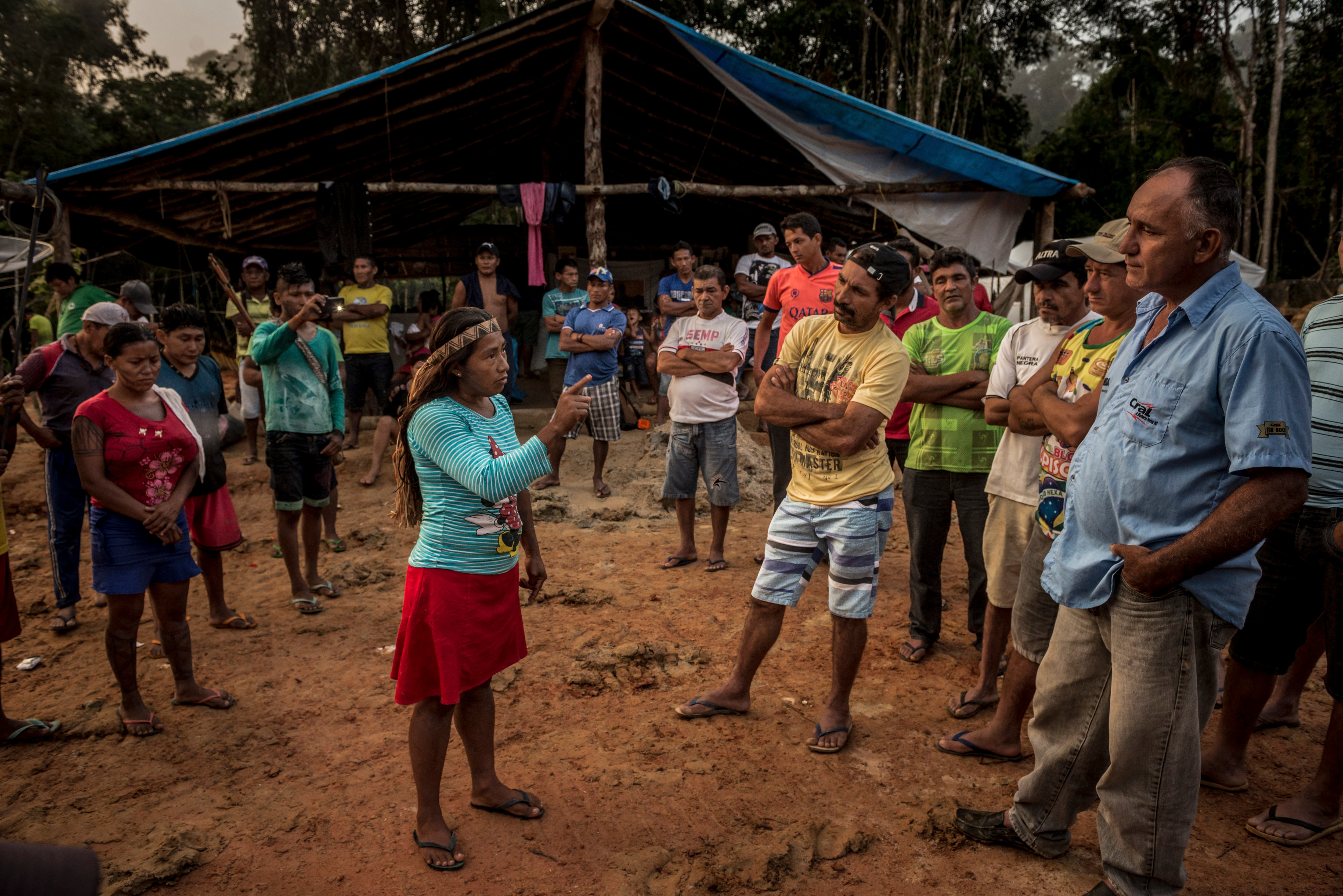 Members of the indigenous Munduruku tribe confront the illegal gold miners and their camp supervisor, Amarildo Dias Nascimento. Members of the indigenous Munduruku tribe confront the illegal gold miners and their camp supervisor, Amarildo Dias Nascimento, far right, who argued that his men had few work options and were merely trying to survive, in the Amazon rainforest in Brazil.