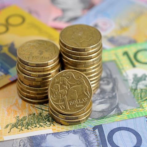 Australian dollars in Sydney, Friday, Jan. 15, 2016. (AAP Image/Joel Carrett) NO ARCHIVING