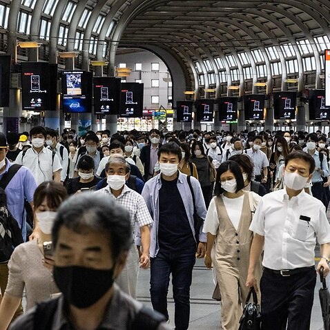 Commuters at Shinagawa station in Tokyo, Japan 