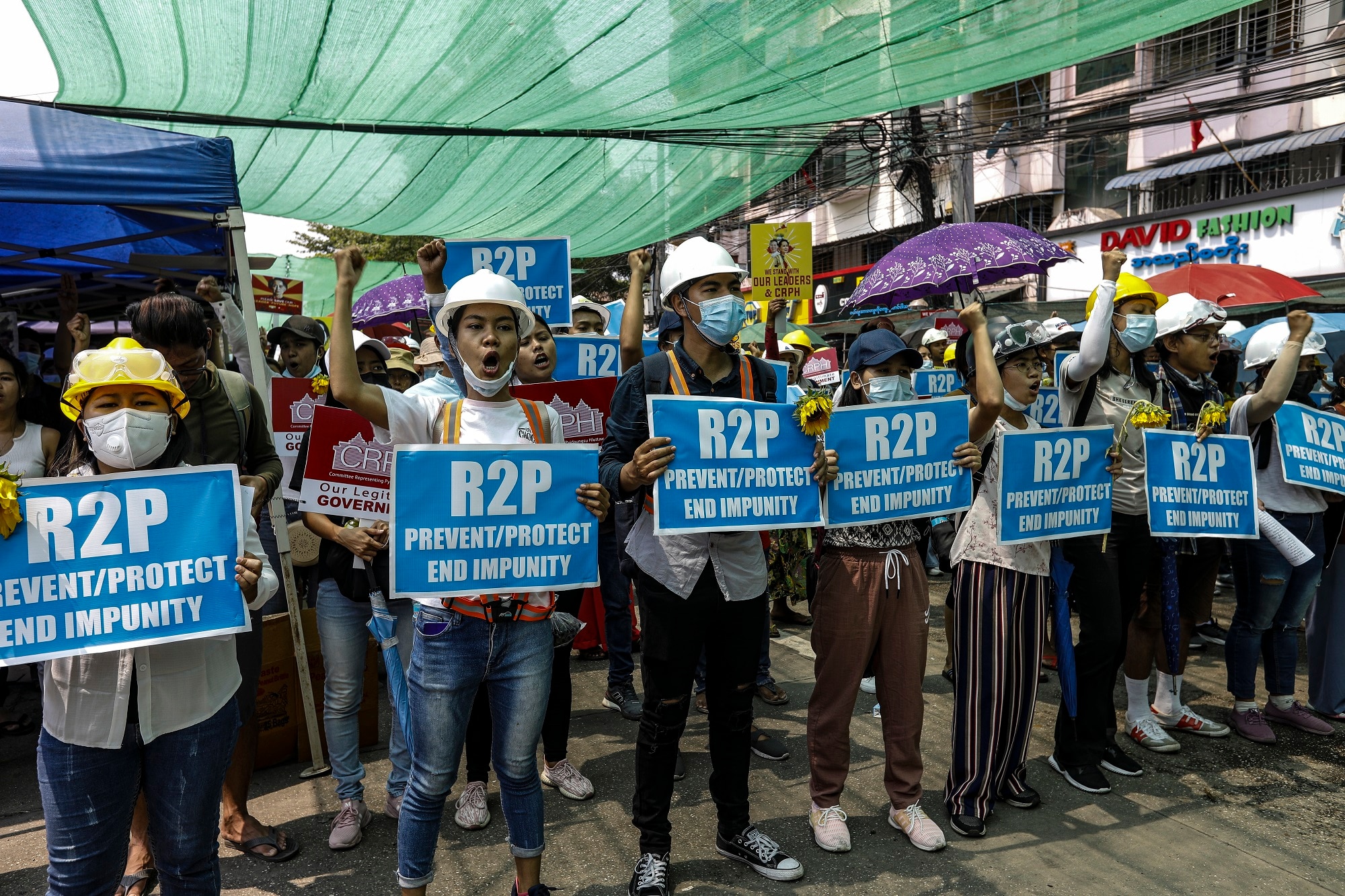 Protesters in the Hlaingthaya (Hlaing Tharyar) township on the outskirts of Yangon, Myanmar, 13 March 2021.  