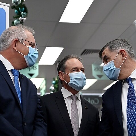 Prime Minister Scott Morrison, Health Minister Greg Hunt and Health Department Secretary Brendan Murphy at press conference in Sydney on 10 December 2021.