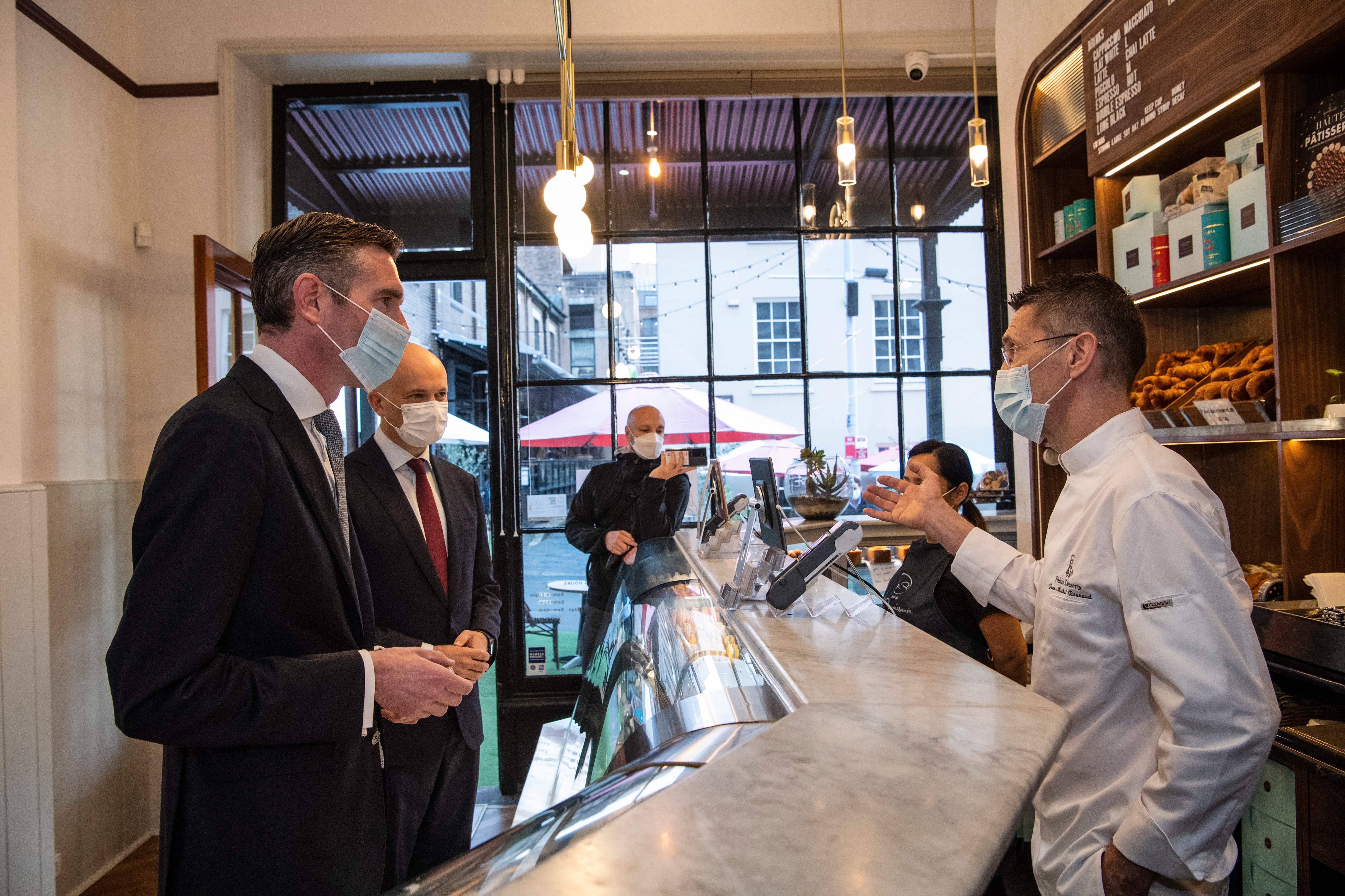 Premier Dominic Perrottet and Treasurer Matt Kean visit La Renaissance Patisserie and Cafe owner Jean Michel, The Rocks. 