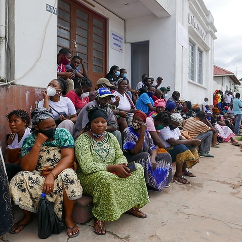 People await the arrival of more ships from Palma district with people fleeing attacks by rebel groups, in Pemba, Mozambique, 29 March 2021. 