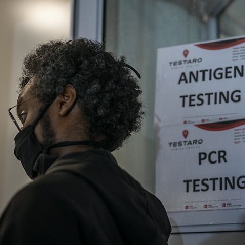 A person queues to be tested for COVID-19 in Johannesburg, South Africa