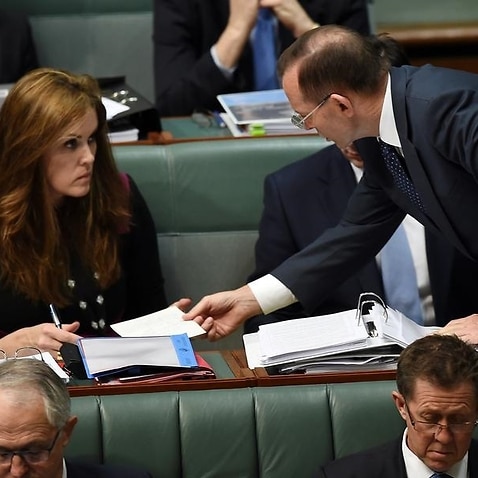 Tony Abbott speaks to chief of staff Peta Credlin in 2015.